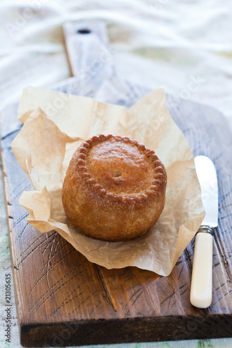 Pork Pie on a chopping board photo