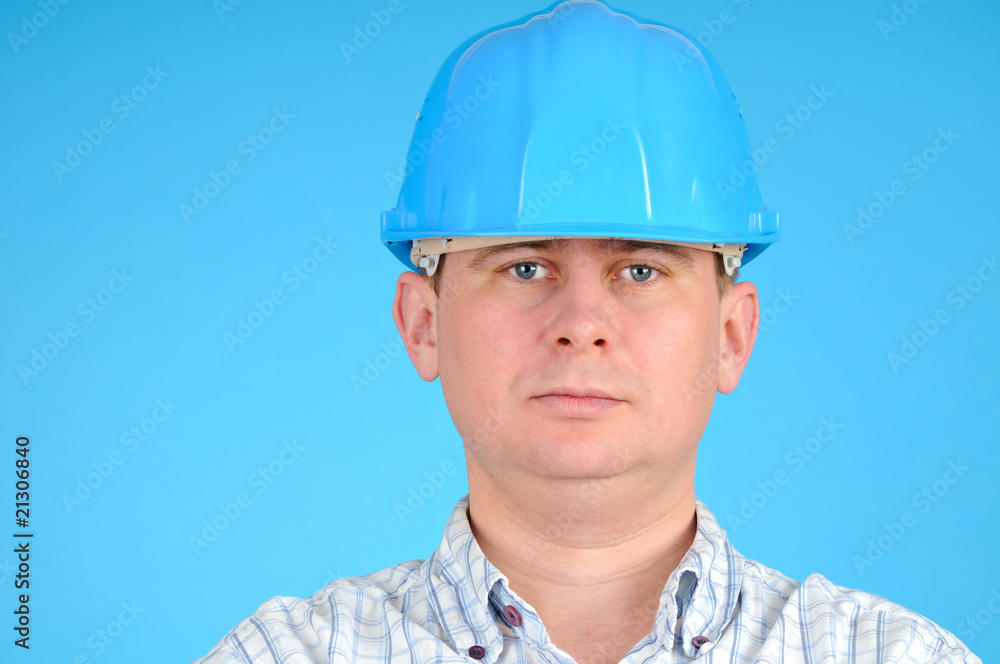 Closeup portrait of a engineer with blue hard hat Closeup portrait of a engineer with blue hard hat