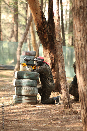 Young man playing paintball