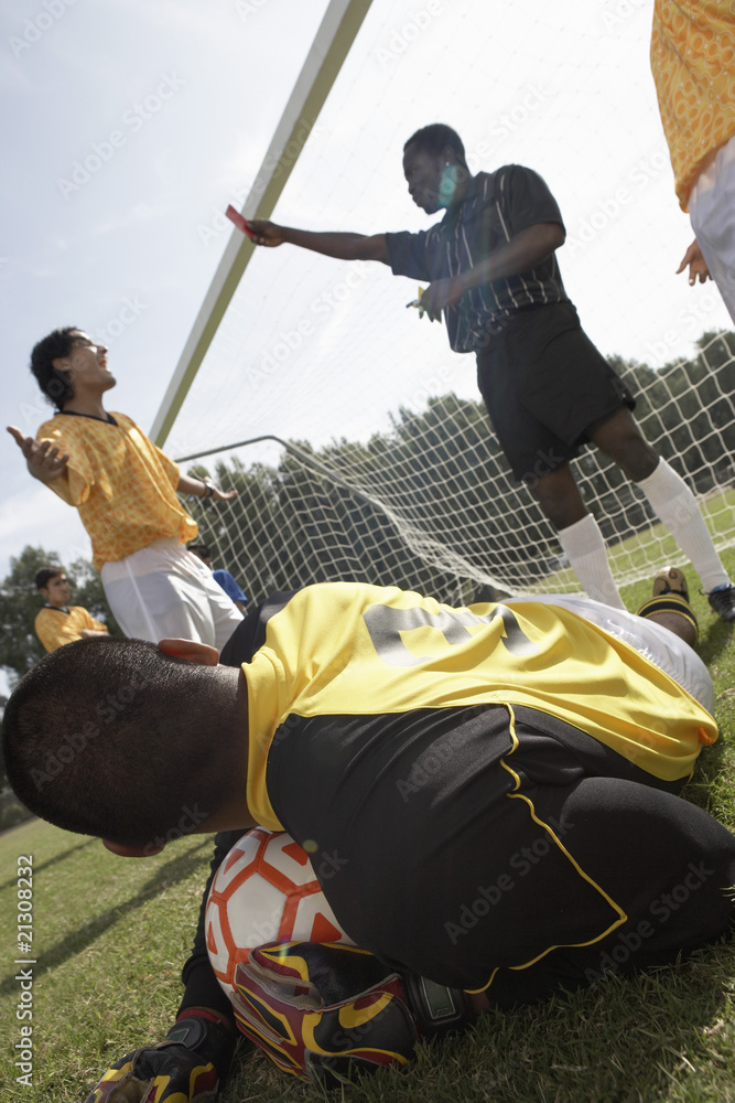 Fototapeta premium Referee Handing Out a Red Card