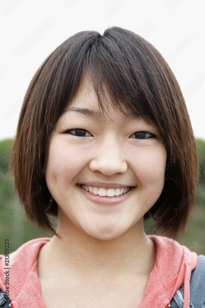 young woman smiling outside close-up portrait young woman smiling outside close-up portrait