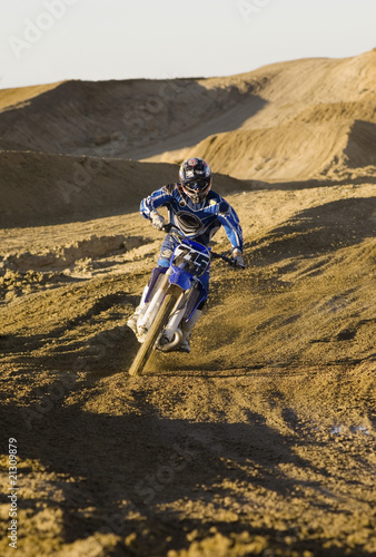 motocross racer riding on dirt track