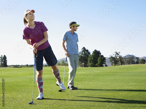 two young golfers on course