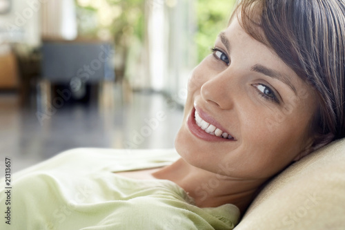 woman relaxing on sofa close-up portrait