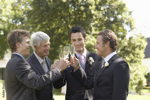 Canvas Print four men toasting at wedding
