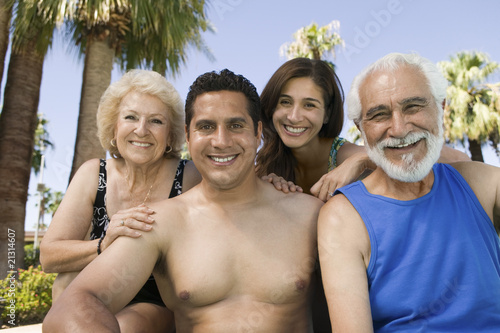 senior couple and mid-adult couple outdoors front view portrait.