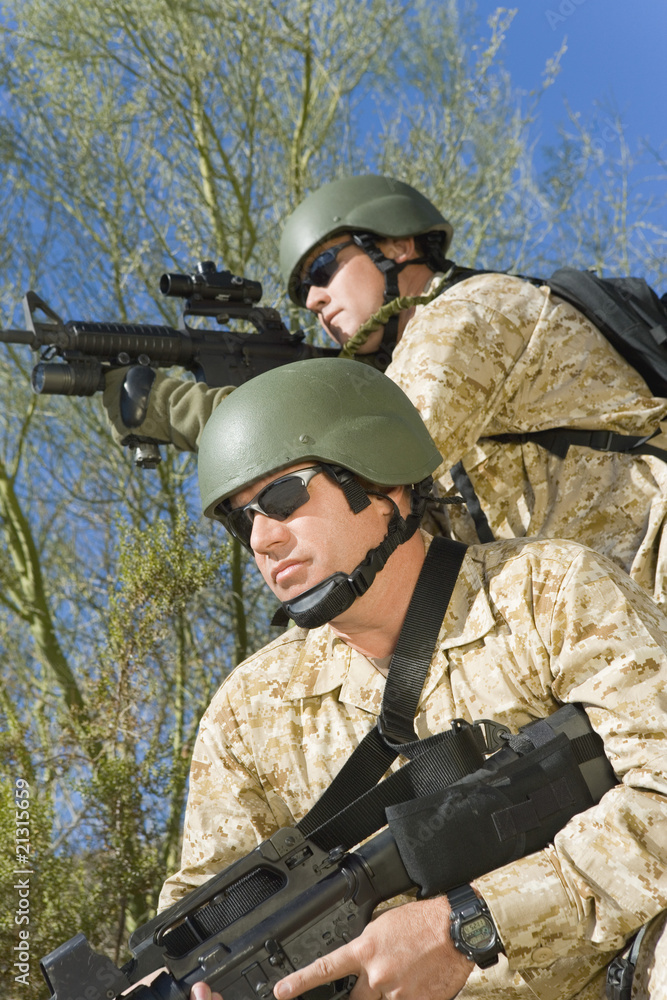 two soldiers on patrol outdoors