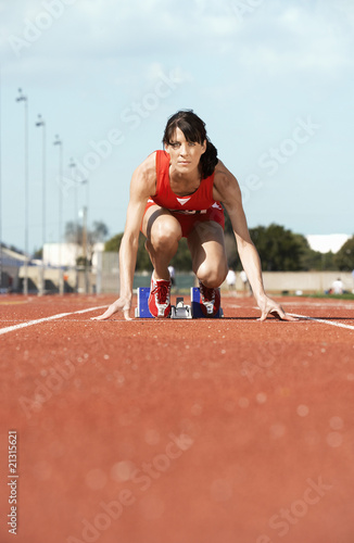 female athlete on starting block