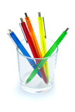Multi-colored pens in a glass