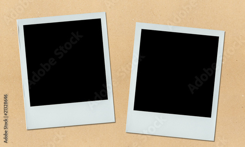 two polaroid photos on bulletin board