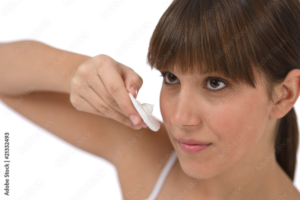 Body care - Female teenager cleaning face