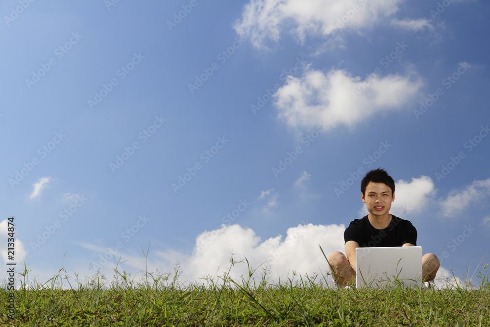 College student with laptop, copy space