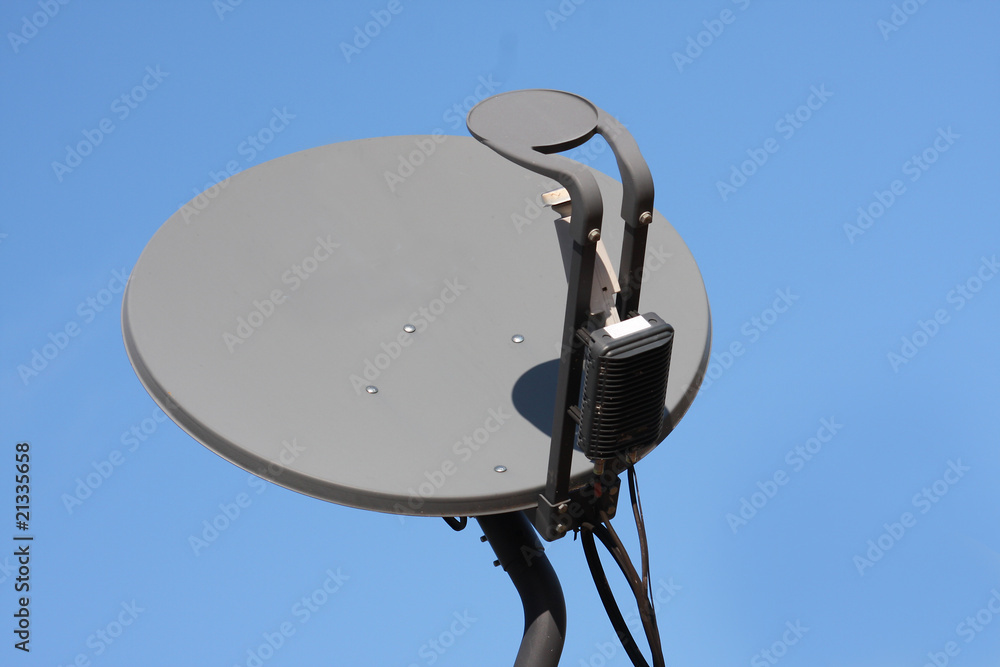 Satellite dish with blue sky background