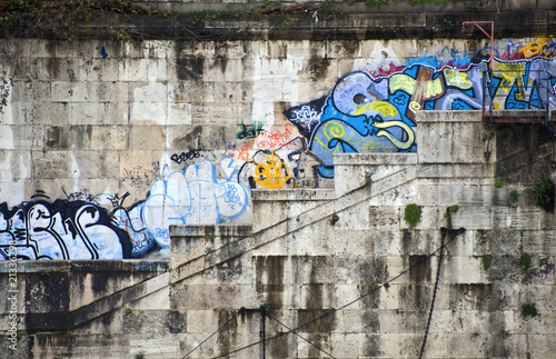 Photography Graffiti on banks of river tiber in rome italy