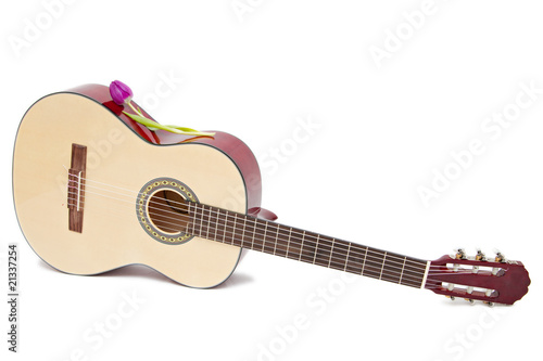 a yellow acoustic guitar isolated on white
