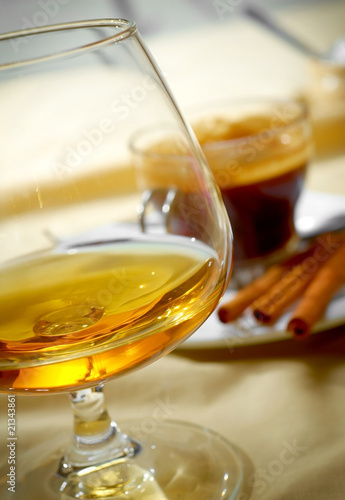 Fototapeta Close up a glass of cognac and coffee