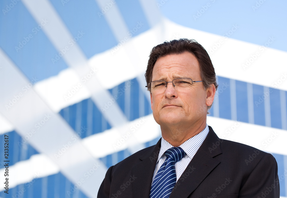 Handsome, Confident Businessman in Front of Building Handsome, Confident Businessman in Front of Building