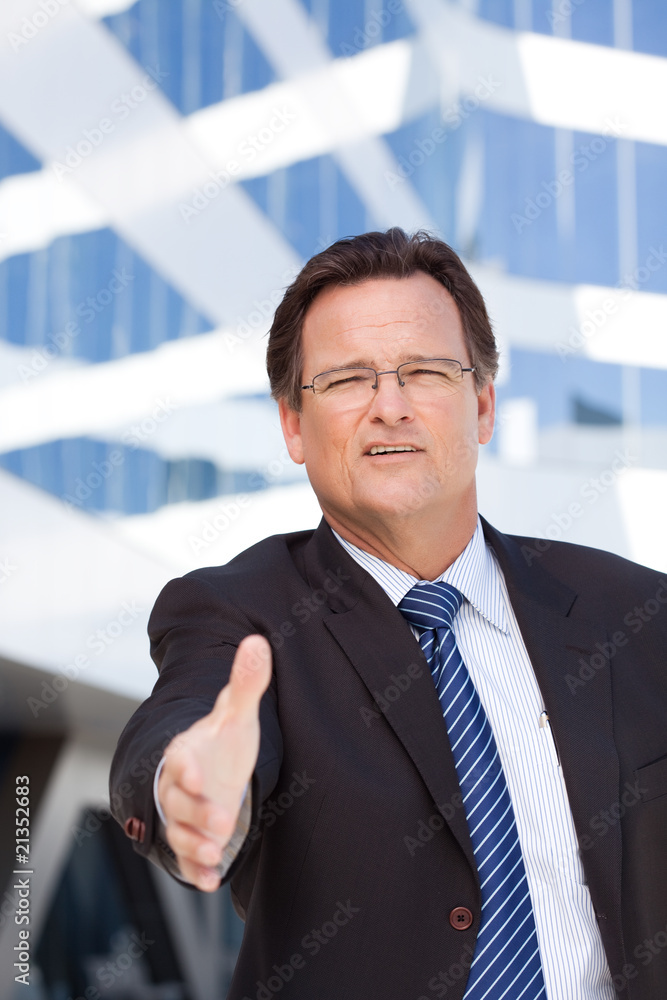 Businessman Outdoors Holds Out His Hand To Shake Businessman Outdoors Holds Out His Hand To Shake
