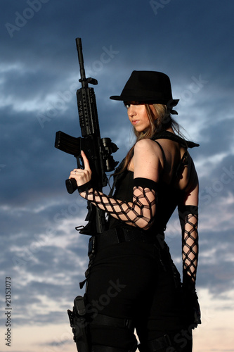 Sexy woman with assault rifle