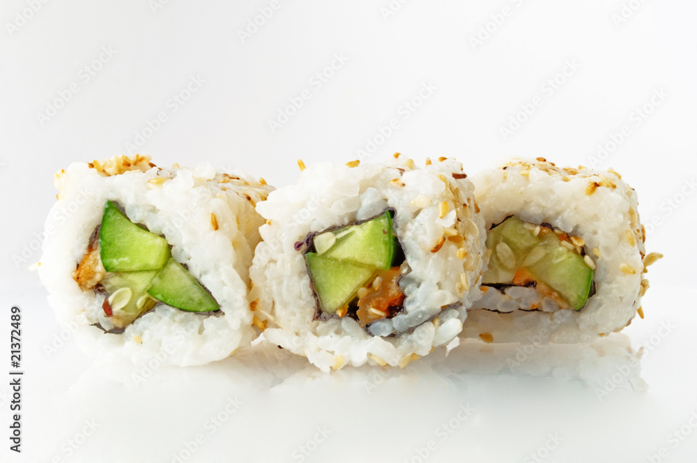 Four rolls strewed with sesame with eel and cucumber Four rolls strewed with sesame with eel and cucumber