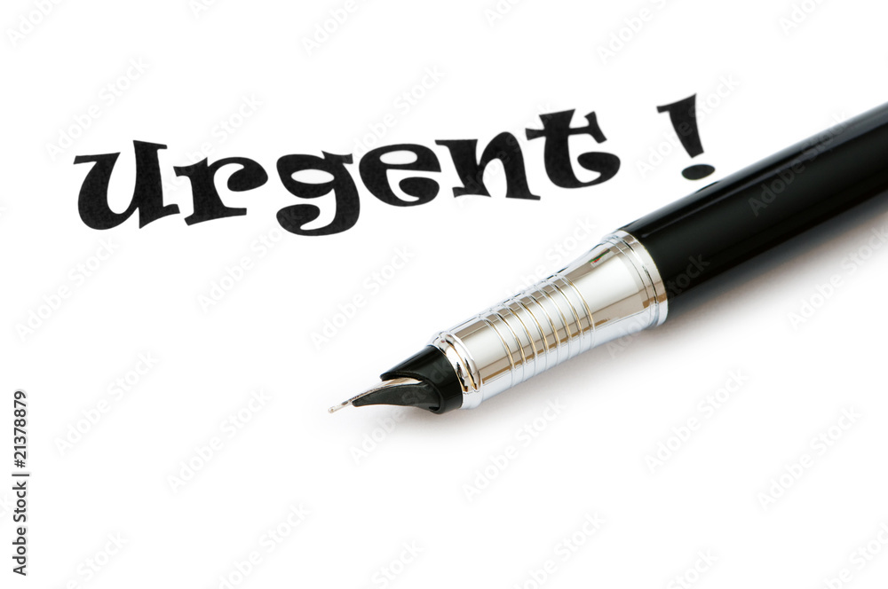 Golden pen and urgent message isolated on white Golden pen and urgent message isolated on white
