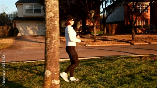 A woman enjoying a brisk morning walk.
