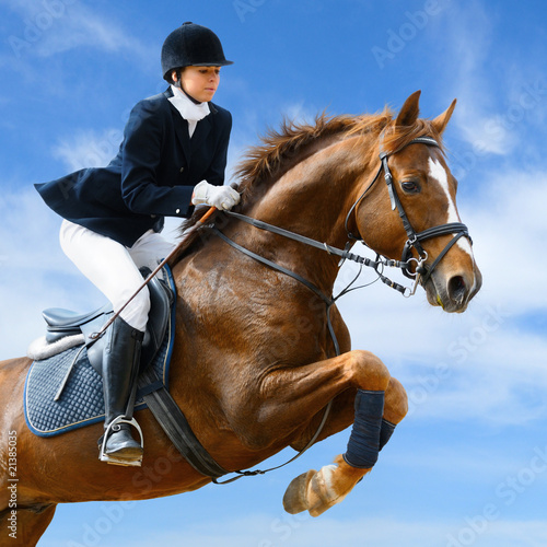 Equestrian jumper - Young girl jumping with sorrel horse