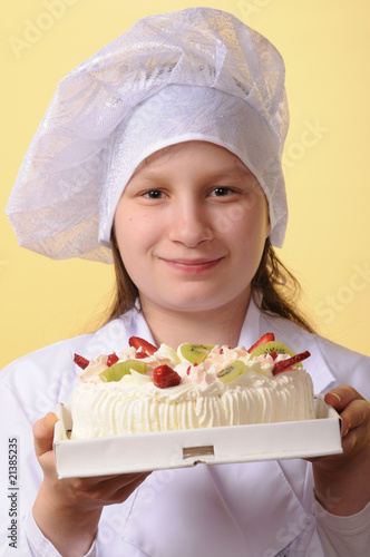 Young chef and a cake