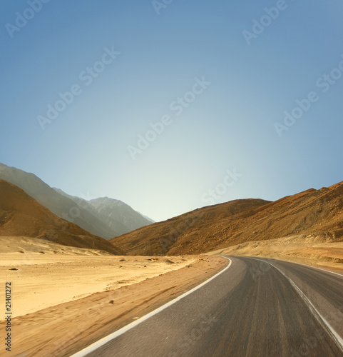 Image of a road on a desert background