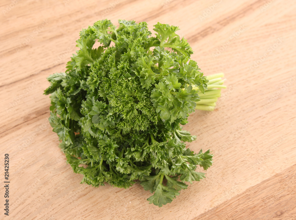 Bouquet of parsley on wooden background Bouquet of parsley on wooden background