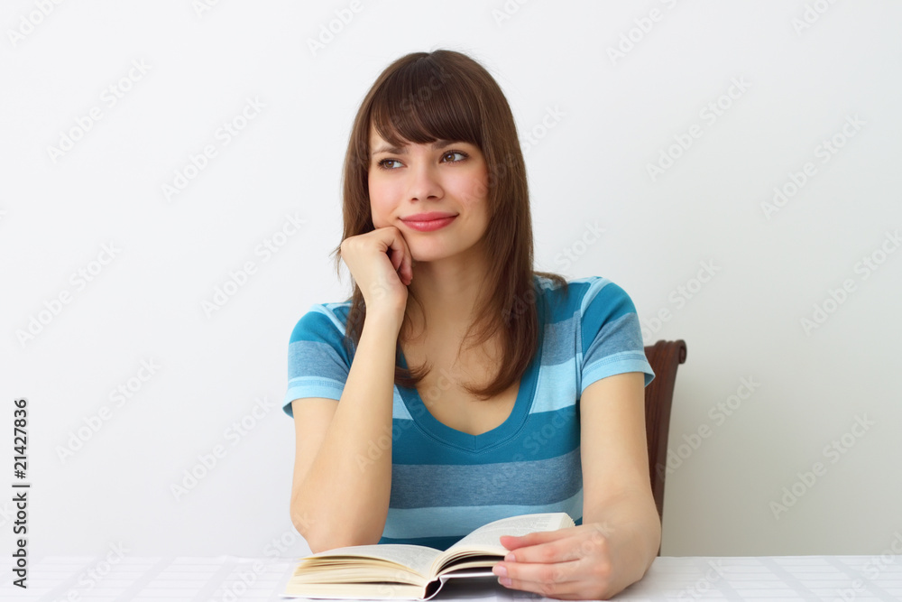 Girl and a book on a light background Girl and a book on a light background