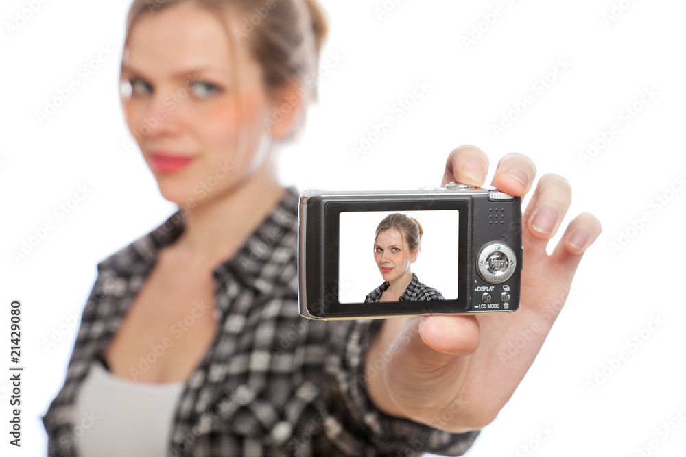 blonde girl taking a photo of herself with a digital camera
