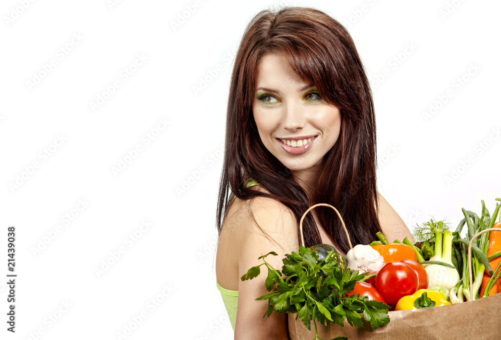 Portrait of a girl holding bag with vegetarian food Portrait of a girl holding bag with vegetarian food