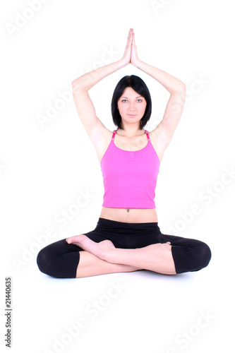 sitting woman in pink t-shirt doing yoga