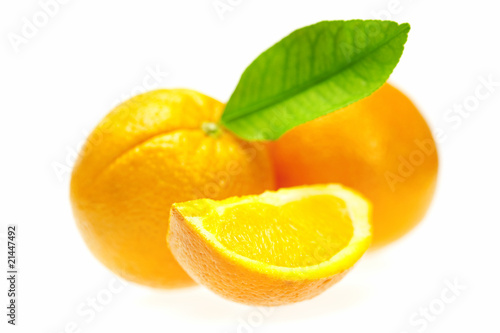 oranges with leaves isolated on white
