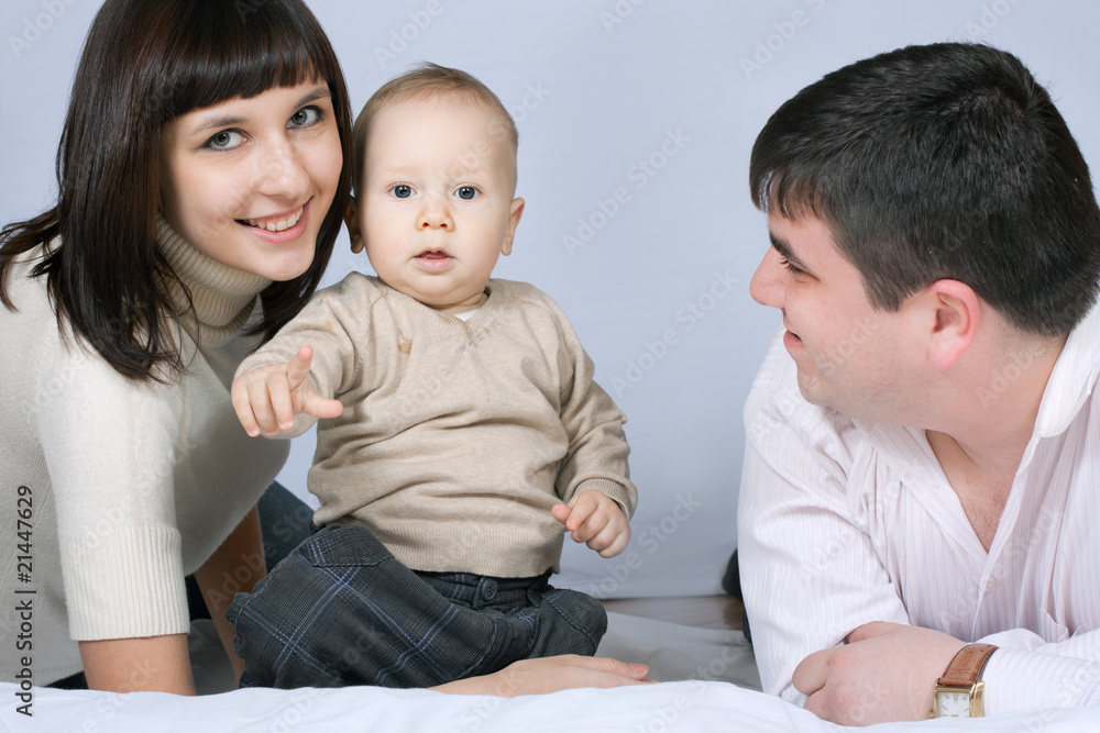 happy family - father, mother and baby happy family - father, mother and baby