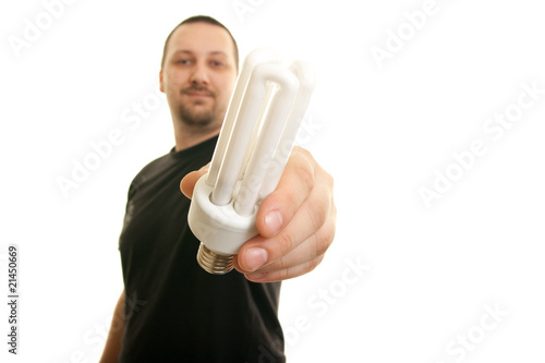man holding  fluorescent  light bulb photo