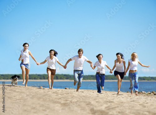 Group of people relaxing on the beach