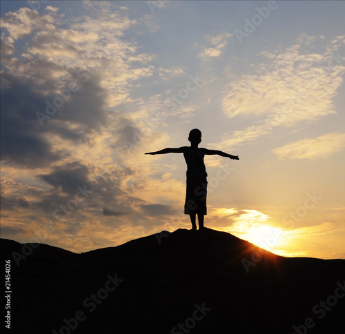 silhouette of young person on mountain