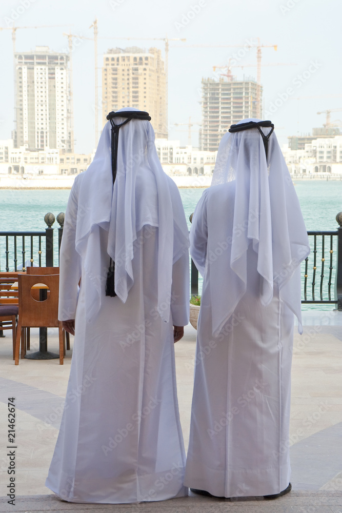 Fototapeta premium Two Anonymous Arab Men Looking At Construction of New Buidings