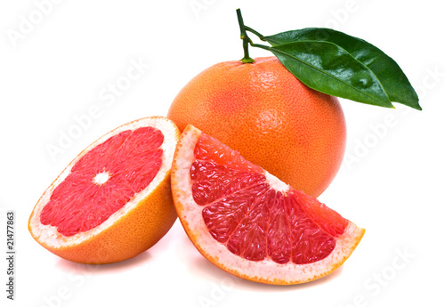 Juicy ripe grapefruit with green leaves