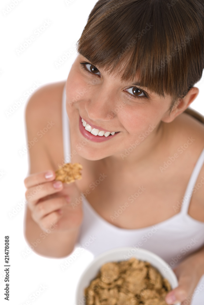 Female teenager eat healthy cereal for breakfast Female teenager eat healthy cereal for breakfast