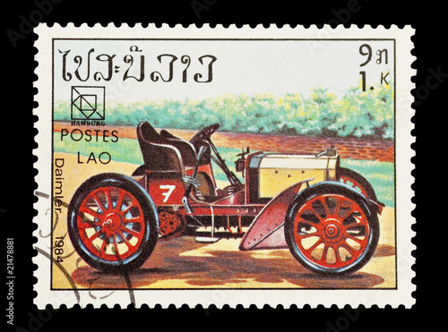 mail stamp from Laos featuring a vintage Daimler sports car