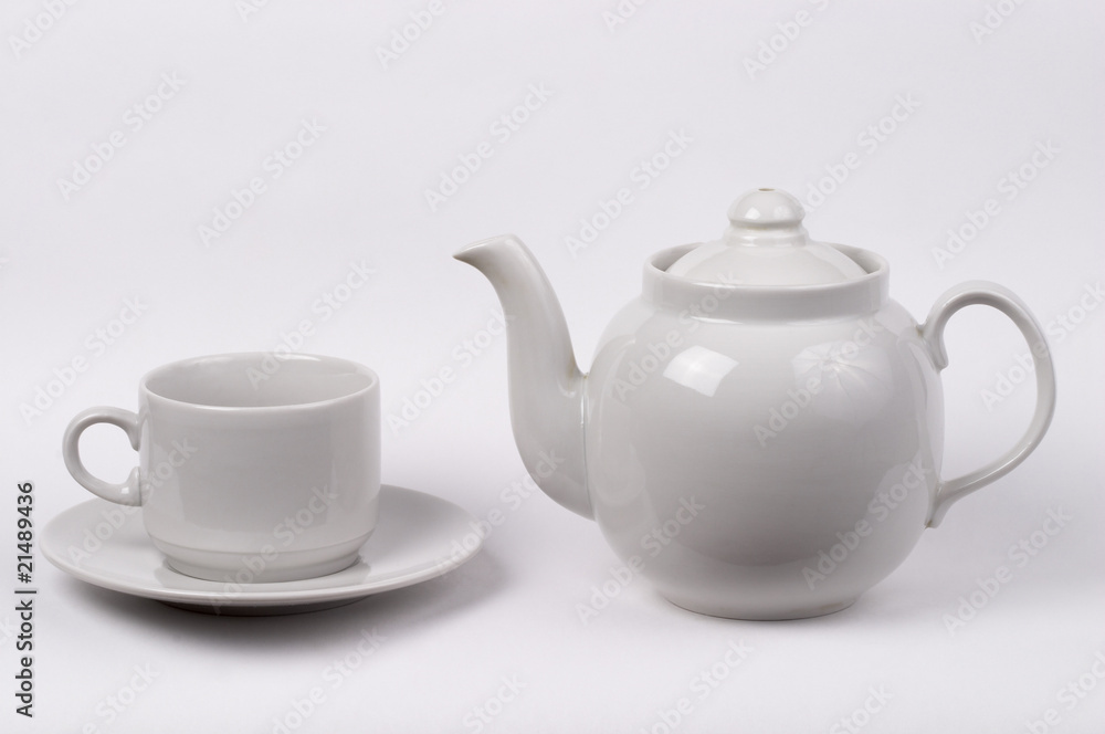 Little white tea cup and a kettle Little white tea cup and a kettle