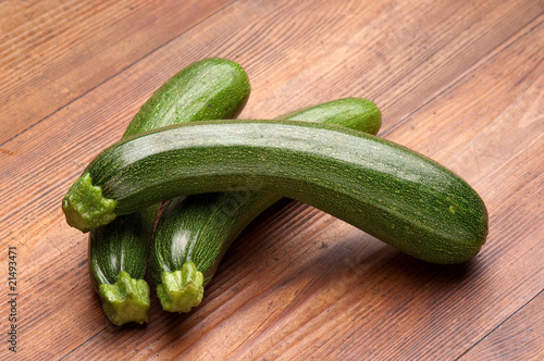 zucchinis on wood background