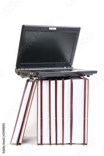 Laptop on a stack of books