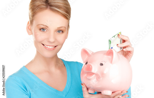 lovely woman with piggy bank and money