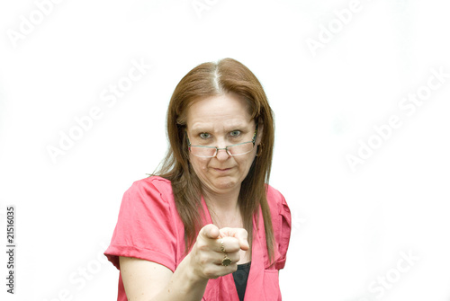 Woman wearing glasses and pointing.