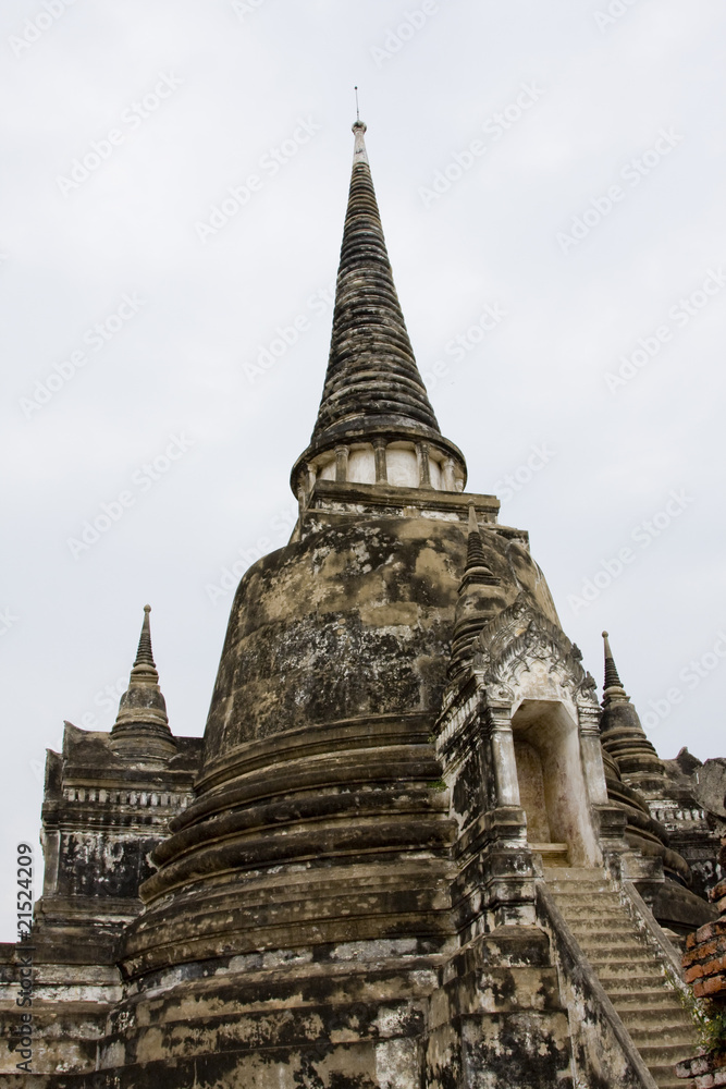 Old stone buddhist stupa in Ayutthaya, Thailand.