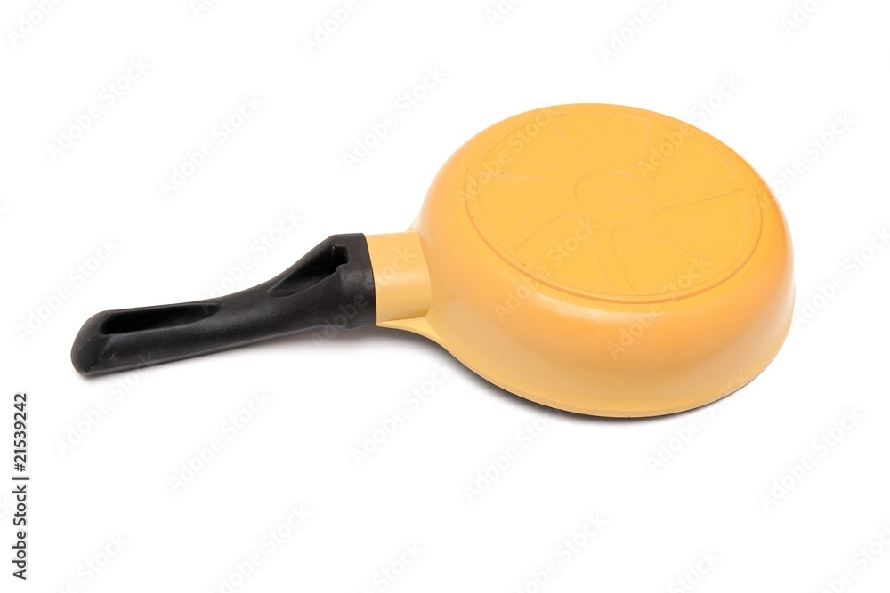 Black and yellow frying pan upside down isolated Black and yellow frying pan upside down isolated